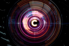 A glowing, futuristic circular design with a letter "C" in the center, featuring vibrant neon colors and concentric patterns.