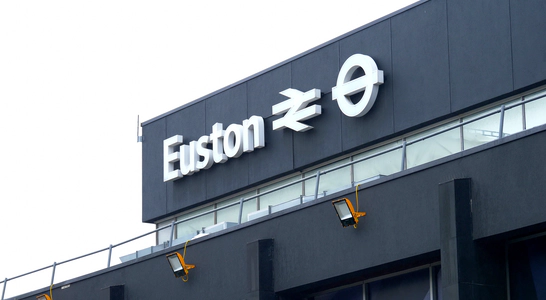 A white sign on a black background reading Euston from the Euston train station.