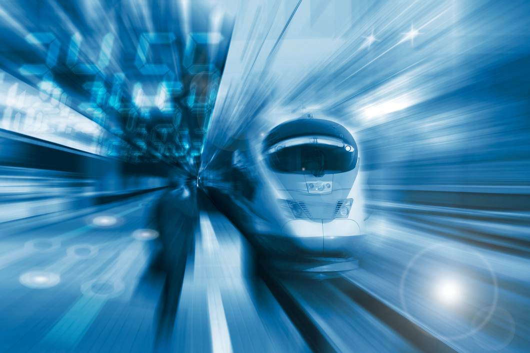 Graphic of a train travelling at high speed past a platform, with a blue blur effect.