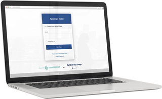 A laptop computer showing the Passenger Assistance Staff Web Platform login page.