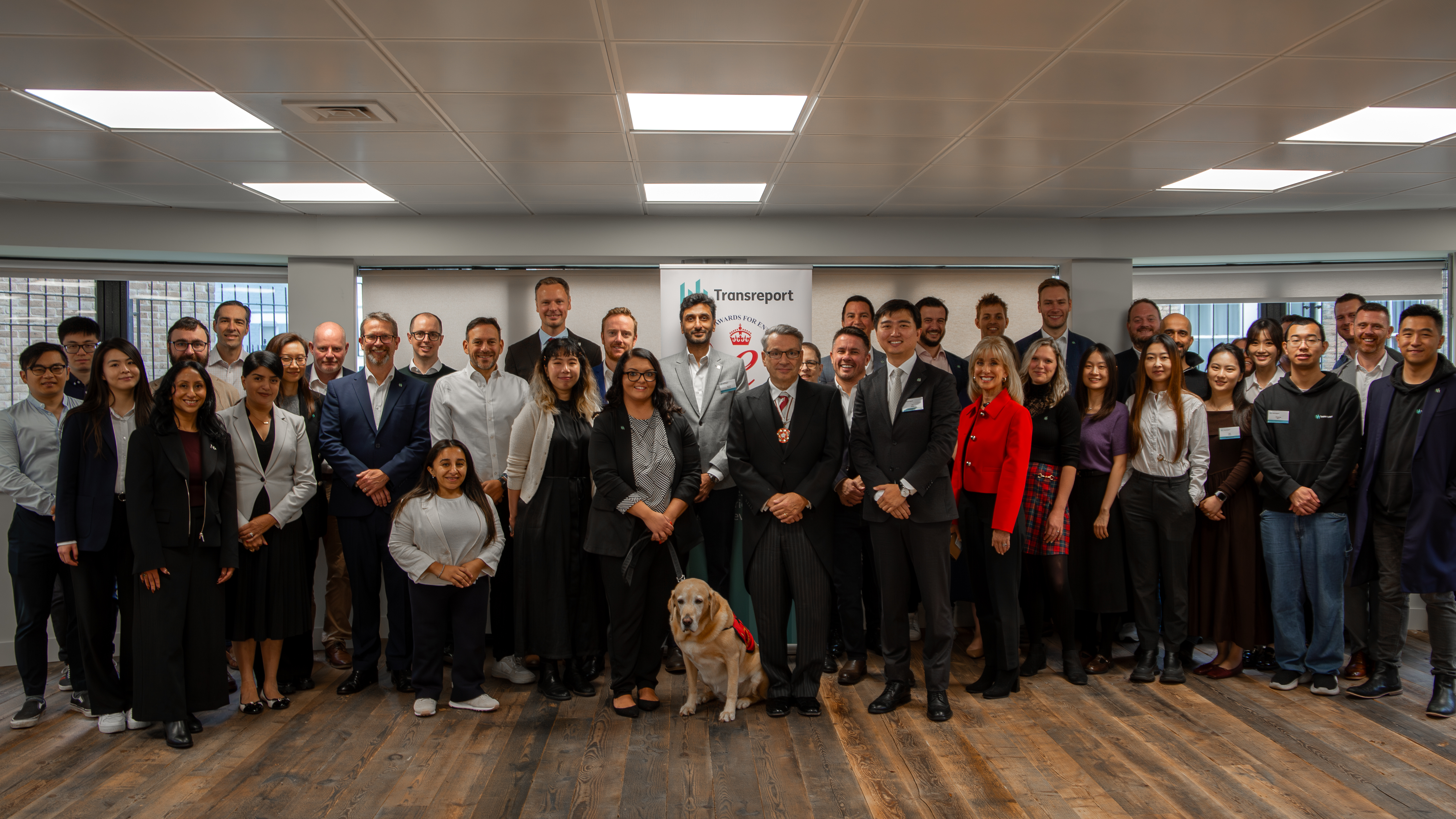 Photo of the Transreport team, Mr Kevin McGrath MRICS OBE DL, and honoured guests at the King’s Award presentation ceremony.
